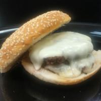 Double Slack · 2 fresh, hand pressed, 3 oz. patties with American cheese on a sesame seeded bun. 