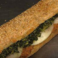 The Godmother Sandwich · Chicken cutlet, sharp provolone, and broccoli rabe on a seeded roll. 