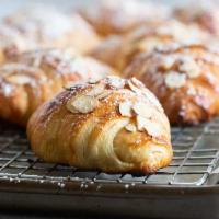 Almond Croissant · Croissant filed with almond cream and topped with sliced almonds