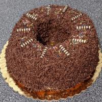 Chocolate Sprinkle Ring · Vanilla round bundt cake covered with chocolate fudge and chocolate sprinkles.