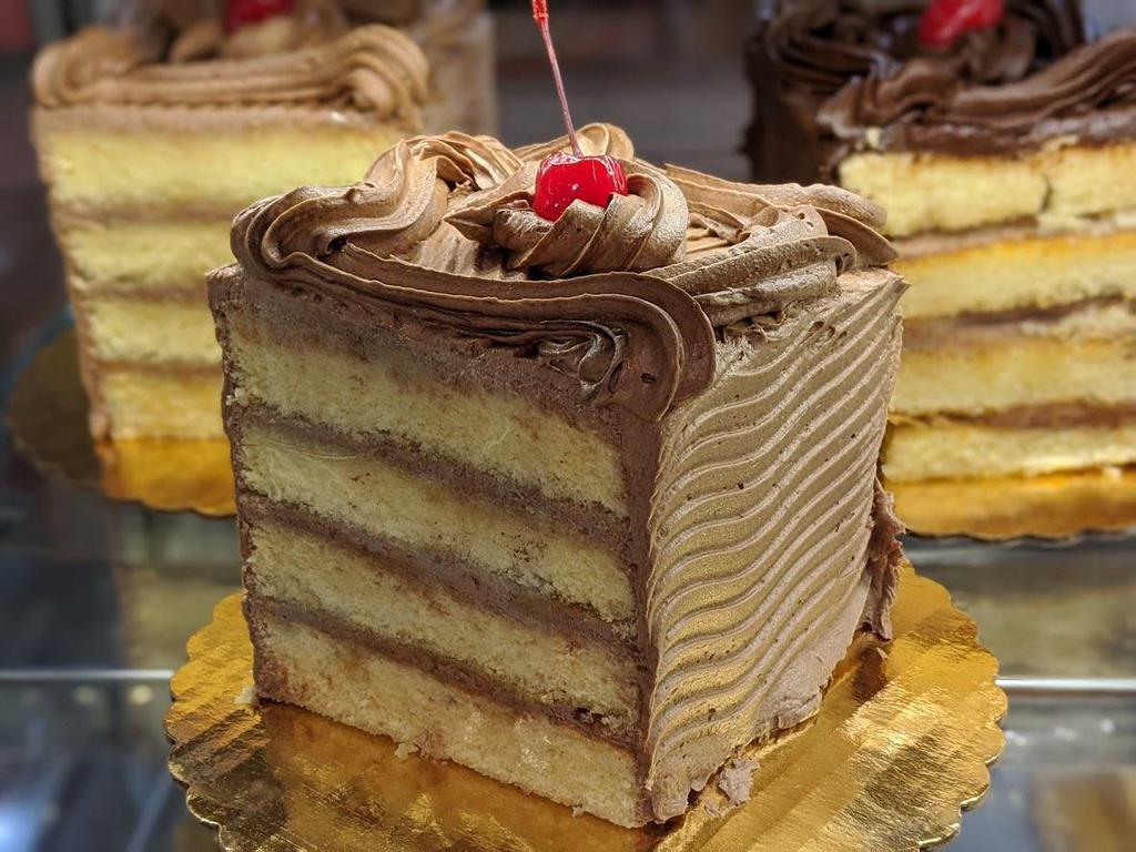 Seven Layer Cake · Vanilla cake with Chocolate buttercream between layers (4-5 servings) Please give at least 1 hour for a double cake