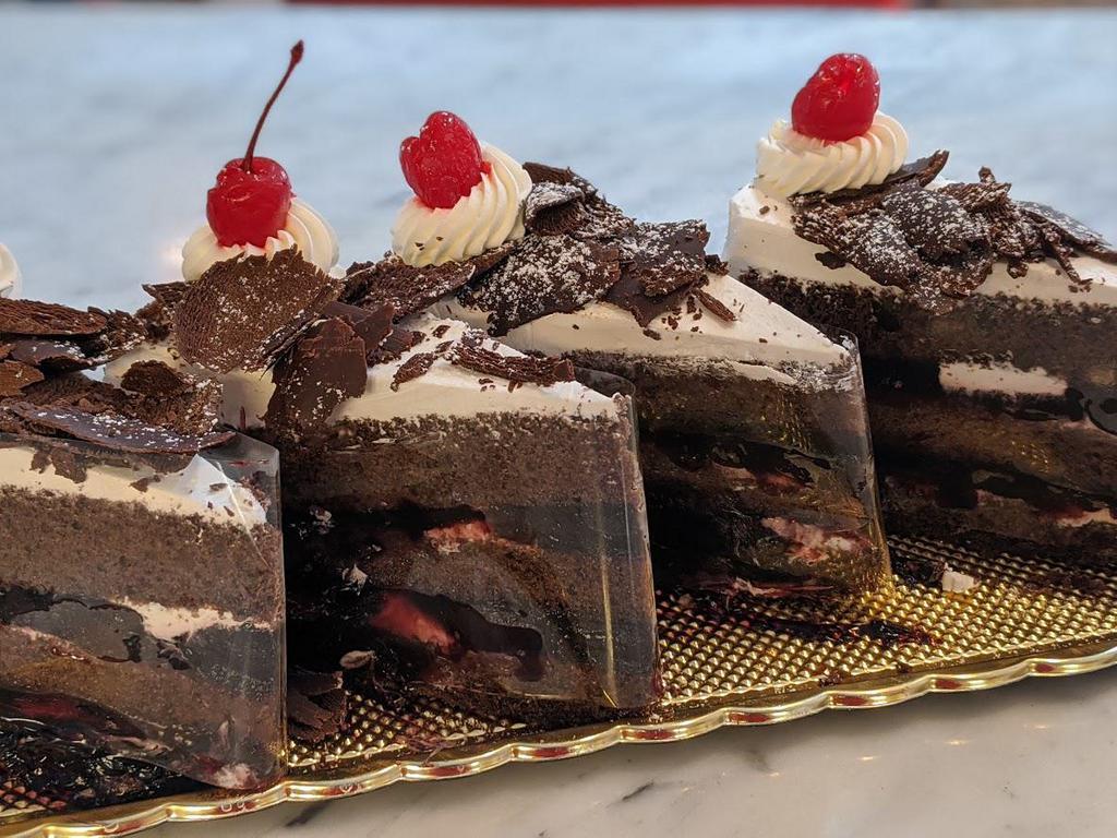 Black Forest Cake Slice · Chocolate cake, black cherries and whipped cream