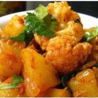 Aloo Gobi Masala Dum  (V) · Cauliflower and potatoes cooked with ginger and fresh Indian spices. Vegan.