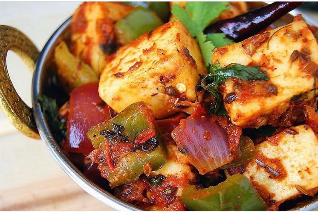Kadai Paneer · Cottage cheese cooked in an Indian wok with spices, peppers and onions.