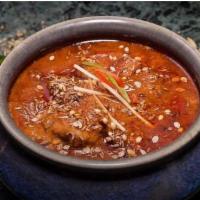 Lamb Rogan Josh · Lamb cubes cooked with onion; tomatoes and yogurt spiced with the chef's special mix and gar...