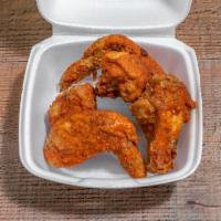 Chicken Wings · Cooked wing of a chicken coated in sauce or seasoning.