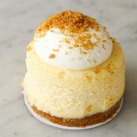 Vanilla Cheesecake to go · Rich vanilla bean cheesecake finished with a graham cracker crust.