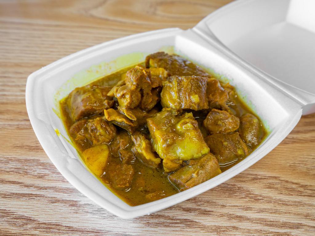 Curry Goat Dinner · Curry seasoned dish. 