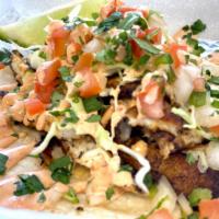 Blackened Fish Taco · Comes on white corn tortilla (gluten free), blackened fish finished with a hint of sweet chi...