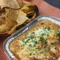 Roasted Corn Dip · Roasted Corn, jalapeños, onions & cheese blend melted together for our signature dip. Served...