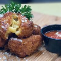 Mac & Cheese Bites · Our classic Mac & Cheese rolled in panko crumbs flash fried and served with marinara sauce. ...