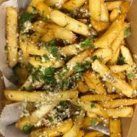 Garlic Parmesan Fries · Our golden crisp fries tossed in a roasted garlic oil fresh Parsley and parmigiana cheese.