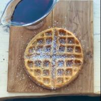 Belgian Waffle · Housemade Belgium waffle topped with powdered sugar and a side of maple syrup.