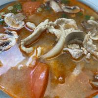 11. Tom Yum Soup · Hot and sour soup with mushrooms, onions, and tomatoes.