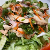 22. Lemongrass Chicken Salad · Grilled chicken with green lettuce, cucumber, tomatoes, onions, cilantro, and carrot in-hous...
