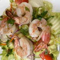 24. Shrimp Salad · Grilled shrimp with green lettuce, cucumber, tomatoes, onion cilantro, and carrot in-house s...