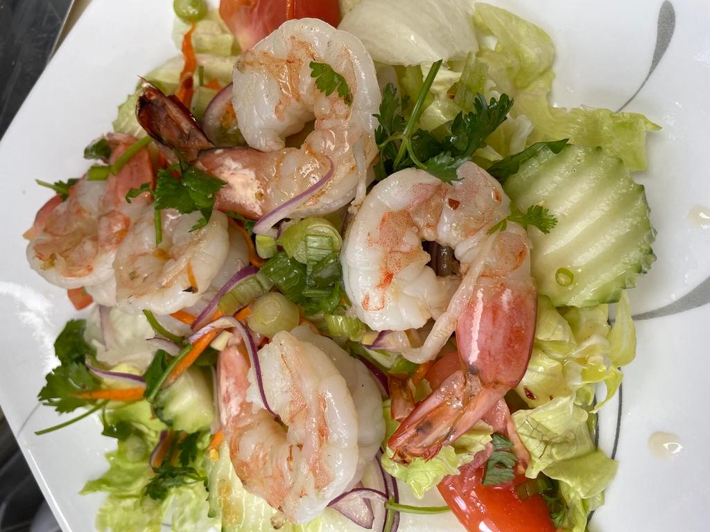 24. Shrimp Salad · Grilled shrimp with green lettuce, cucumber, tomatoes, onion cilantro, and carrot in-house special lime juice.