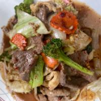 62. Thai Special Combo · Combination with beef, pork, and chicken, broccoli, carrot cabbage, onions, and basil in chi...