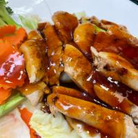 67. Teriyaki Chicken · Grilled marinated chicken breast with broccoli, carrots, and cabbages topped with teriyaki s...