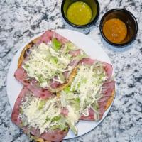 Jamon Tostada · Ham. acompanado con lechuga, queso, y crema. Comes with lettuce, cheese, and cream.

