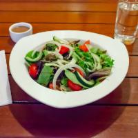 Mixed Greens Salad · Tomato, red onion, cucumber, pepitas, smoked raisin sherry vinegar. Vegan, contains nuts.