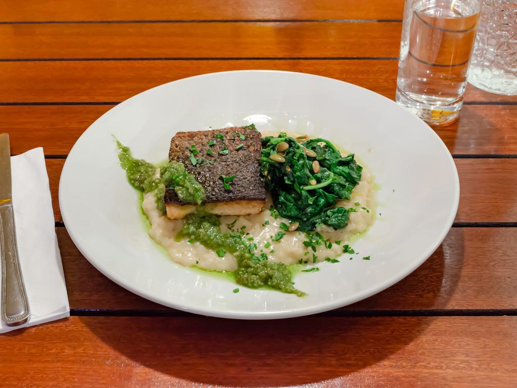 Pan Seared Salmon  · Parmesan risotto, spinach, pesto.