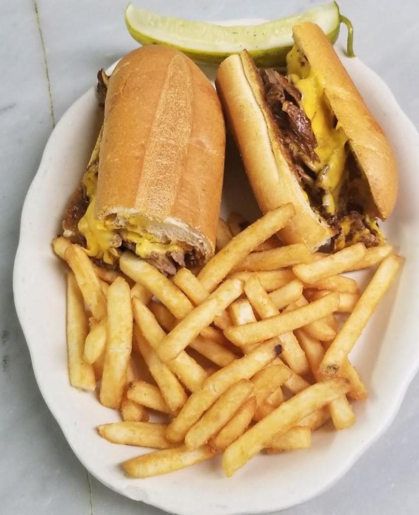 Philly Cheese Steak Sandwich with Onions · Served with french fries.