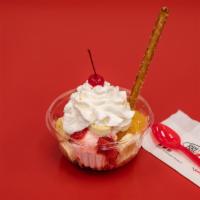 Banana Split · 3 scoops of ice cream (vanilla, chocolate, strawberry), vanilla ice cream topped with pineap...