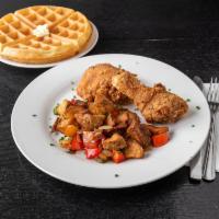 Chichen N Waffles · Belgium style waffle with breakfast potatoes and fried chicken. White meat for an additional...