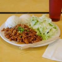 Spicy Pork Teriyaki Plate · Korean style spicy pork with house made spicy sauce, side salad and rice. Topped with toaste...