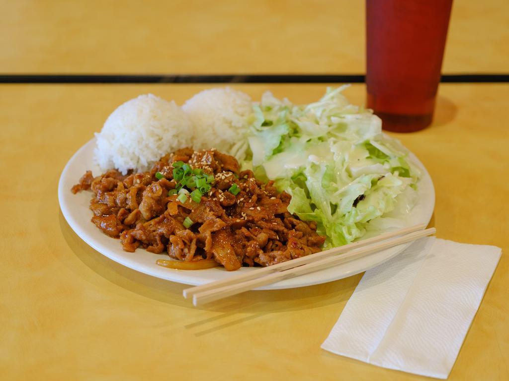 Spicy Pork Teriyaki Plate · Korean style spicy pork with house made spicy sauce, side salad and rice. Topped with toasted sesame seeds and green onions.