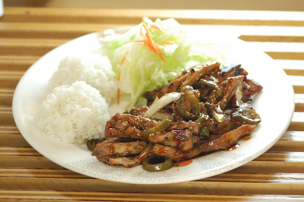 Jalapeno Chicken · Chicken teriyaki stir fried with jalapeños and onions, topped with toasted sesame seeds. Served with side salad and rice.