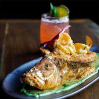 El Chillo Mama · Flaky and juicy fried red snapper stuffed with shrimp mofongo, topped with a creamy garlic s...