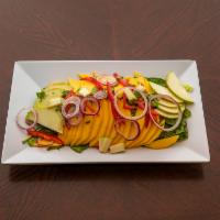 Mango Salad · Mix green salad with apple, onions, peppers, red wine cilantro vinaigrette.