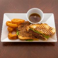 French Dip Panini · Roasted beef, lettuce, muenster cheese, caramelized onions on rustic panini bread with au ju...