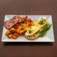 Eggs Benedict · Poached eggs on an English muffin served with asparagus, Canadian bacon, hollandaise sauce, ...