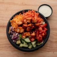 BBQ Chicken Salad · Romaine Mix with Tomatoes, Carrots, Red Onion, and Cucumbers, topped with Smothered BBQ chop...
