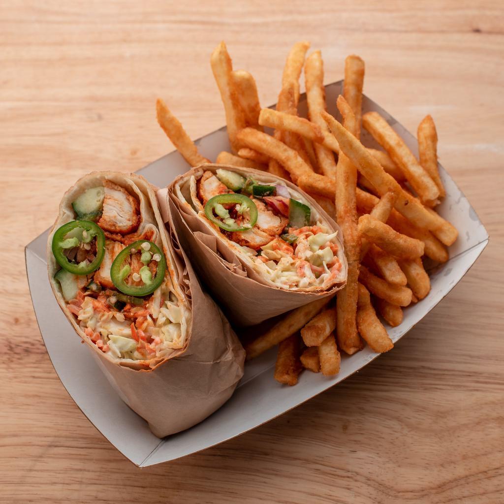Spicy Korean Wrap · Crispy Chicken Tender Wrap with Spicy Korean Sauce, Coleslaw, Cucumber, Red Onion, Sesame Seeds, Green Onion, Fresh Jalapeno and Cilantro. Choice of Dressing on the Side. Served with French Fries