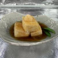Agedashi Tofu · Silky tofu lightly buttered and
fried. Garnished with radish sprouts
and spicy grated daikon...
