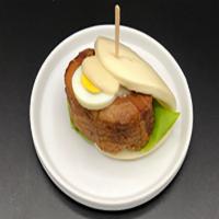 Butakaku Bao · Bun with tender pork belly, lettuce, boiled egg,
and Japanese mayo.