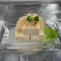 Traditional Japanese Hiyayako · Chilled tofu topped with bonito flakes, grated ginger,
green onions and served with soy sauce.