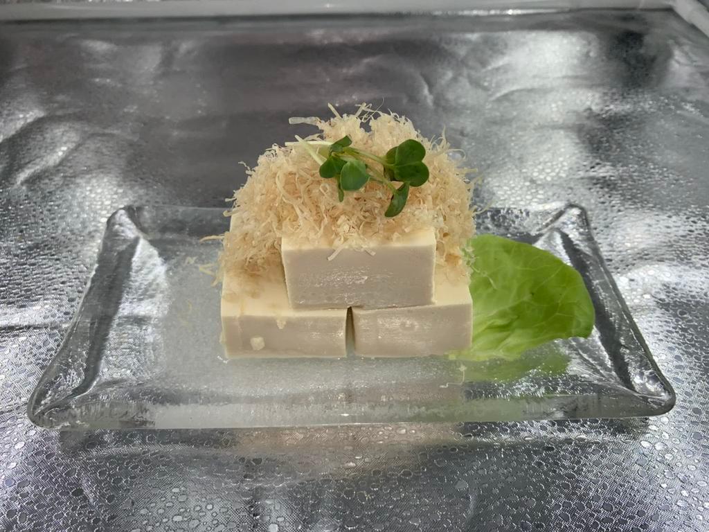 Traditional Japanese Hiyayako · Chilled tofu topped with bonito flakes, grated ginger,
green onions and served with soy sauce.