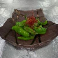 Blistered Shishito Peppers · roasted shishito peppers sauted with garlic aioli.
Sometimes super spicy so be careful!