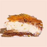 Signature Baklava Cheesecake · Our signature greek made baklava mixed with original creamy cheesecake.

This Baklava Chee...
