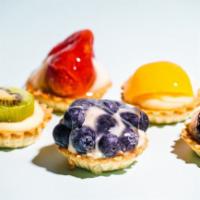 Mini Fruit Tarts · Fresh fruit slices & a sweet custard filling on top of a bite-sized cookie shell–these mini ...