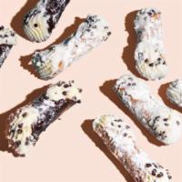 Mini Cannolis · Crunchy shell, smooth and sweet Ricotta cheese, and rich chocolate chips.
