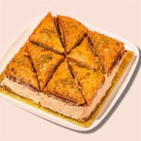 Signature Baklava Cheesecake Whole Cake · Serves 12- 14 
TWO AMAZING DESSERTS TOGETHER AS ONE. Our signature greek made baklava mixed...