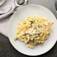 Fettuccine Alfredo  · Homemade Alfredo sauce tossed with fettuccine noodles topped with Parmesan cheese.