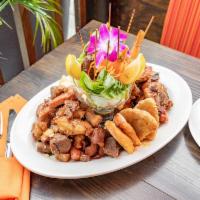 Picadera Taina · Mixed platter of fried chicken chunks, crispy pork, sausage, grilled skewers (shrimp, choriz...