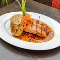 Salmon · Grilled salmon dressed with a sweet chili passion fruit glaze, served with shrimp chofan ric...